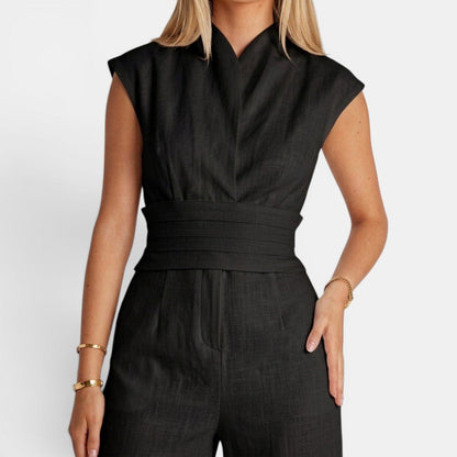 Tuta intera donna elegante con scollo a V e drappeggio fluido